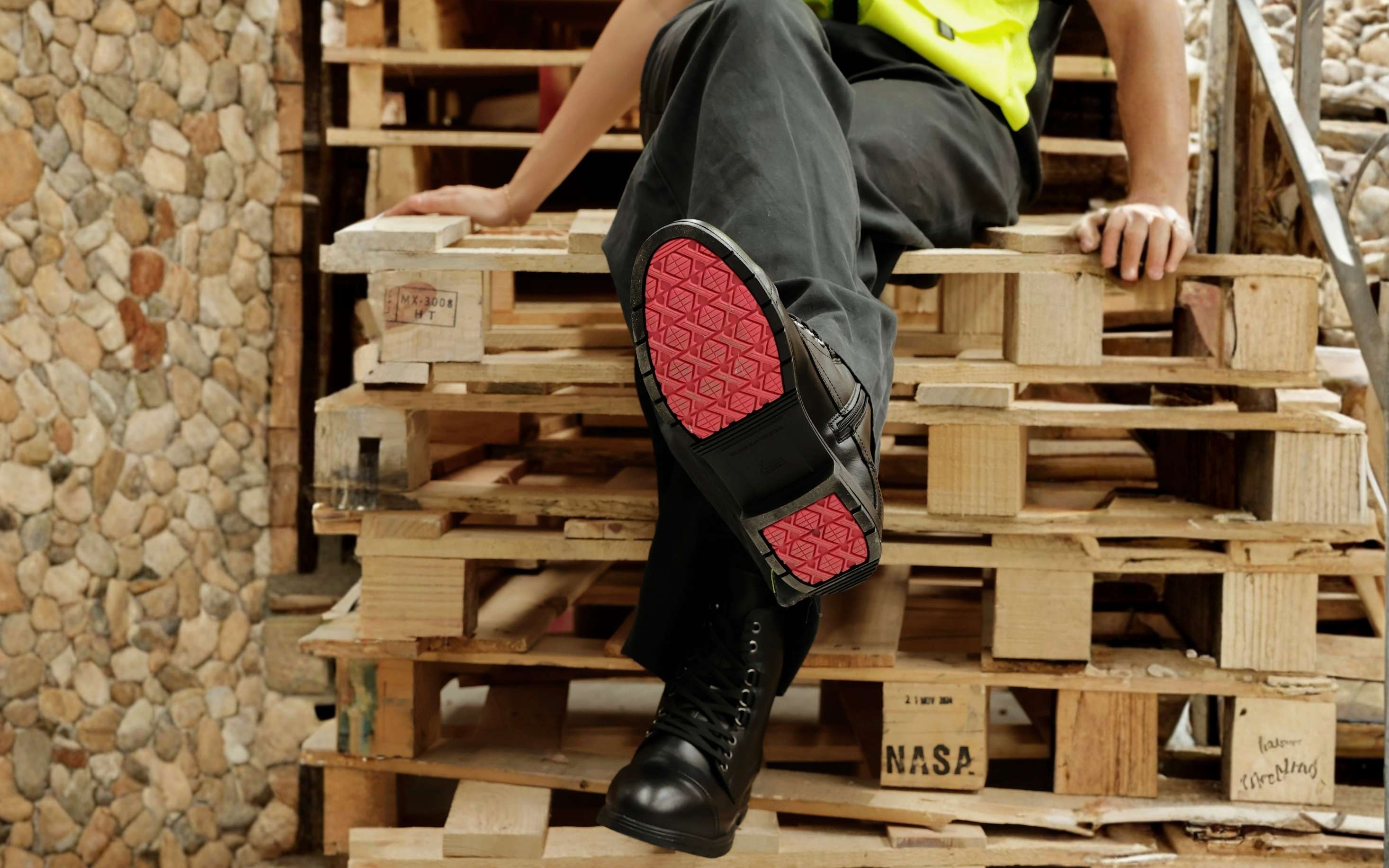 Spice EH Safety Boot for Women — Coral · lifestyle photo showing coral outsole worn on the job site