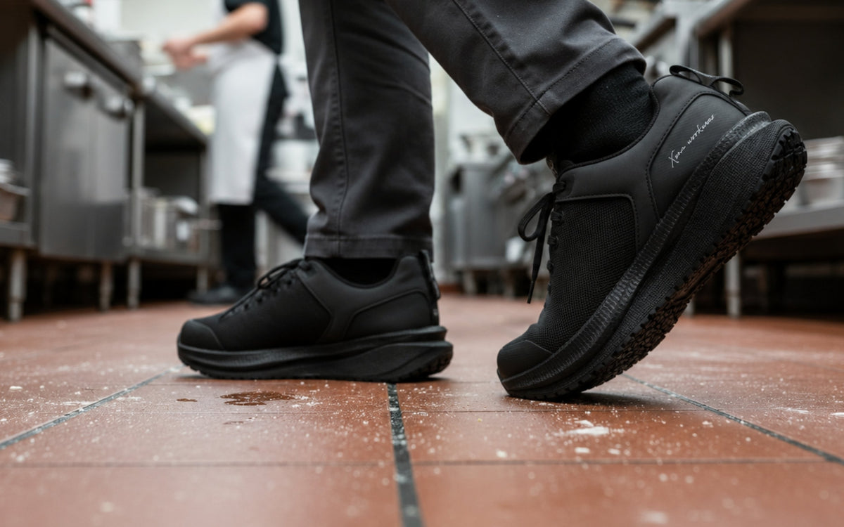 Astra Lite Composite Toe Safety Sneaker for Women — Black Mesh EH PR SRO Rated · lifestyle photo close-up in a kitchen setting