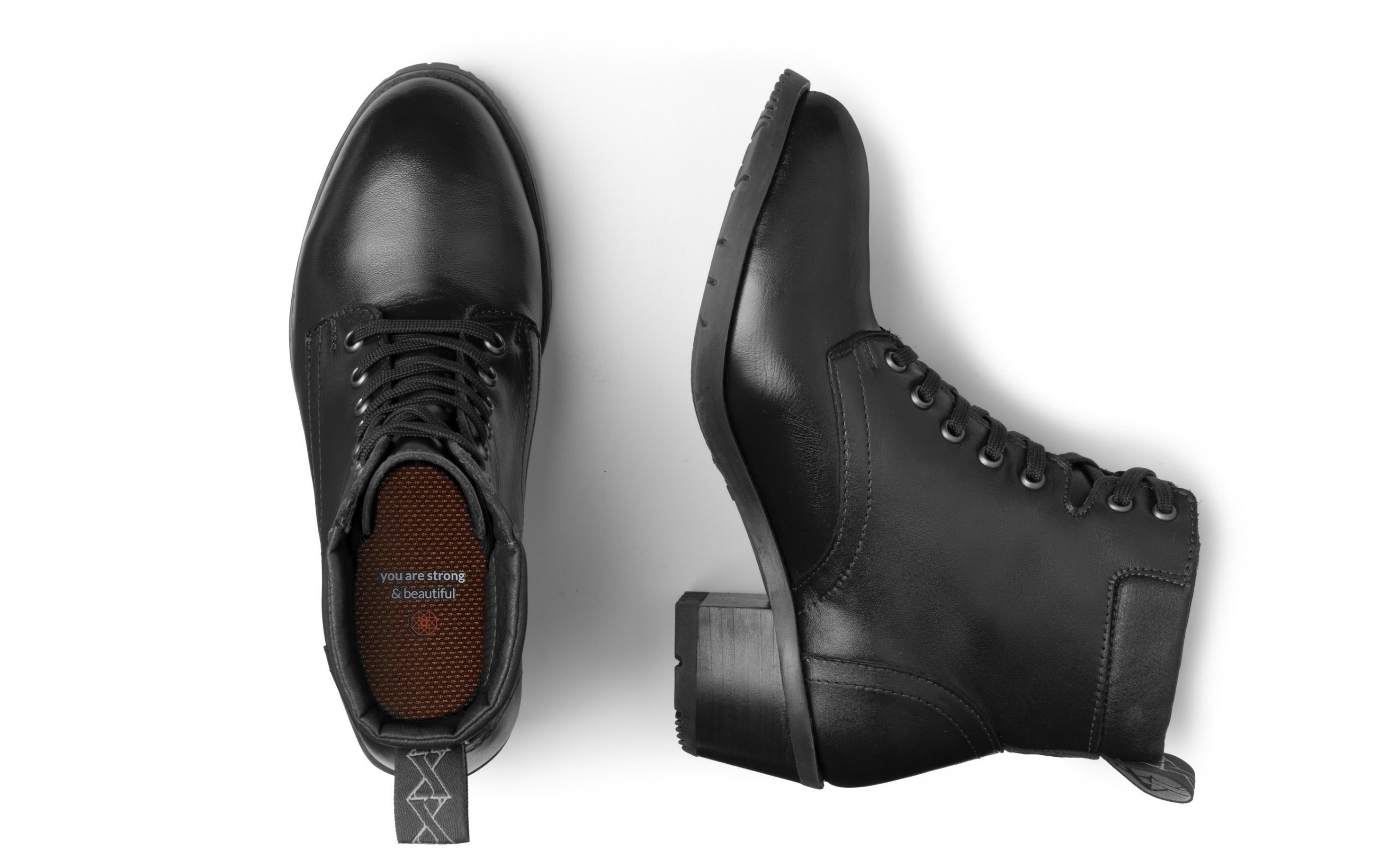 Xena Vega women's steel-toe safety boots in classic black leather, top-down pair view